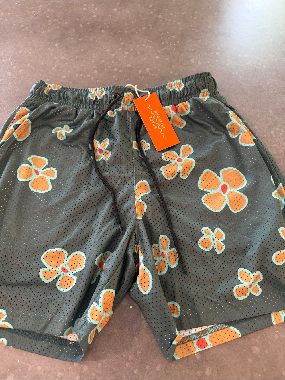 Men's Floral Mesh Swim Trunks in Dark Green with Orange Print